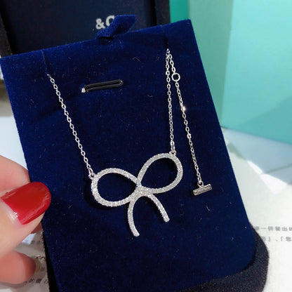 [Hyrra Jewelry]CLAW SET RHODIUM PLATED BOW NECKLACE