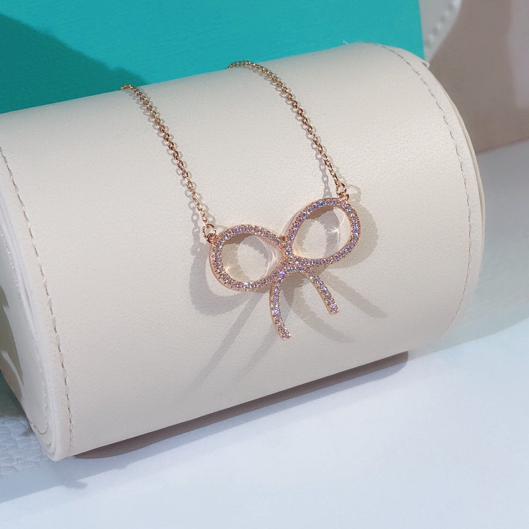 [Hyrra Jewelry]CLAW SET RHODIUM PLATED BOW NECKLACE
