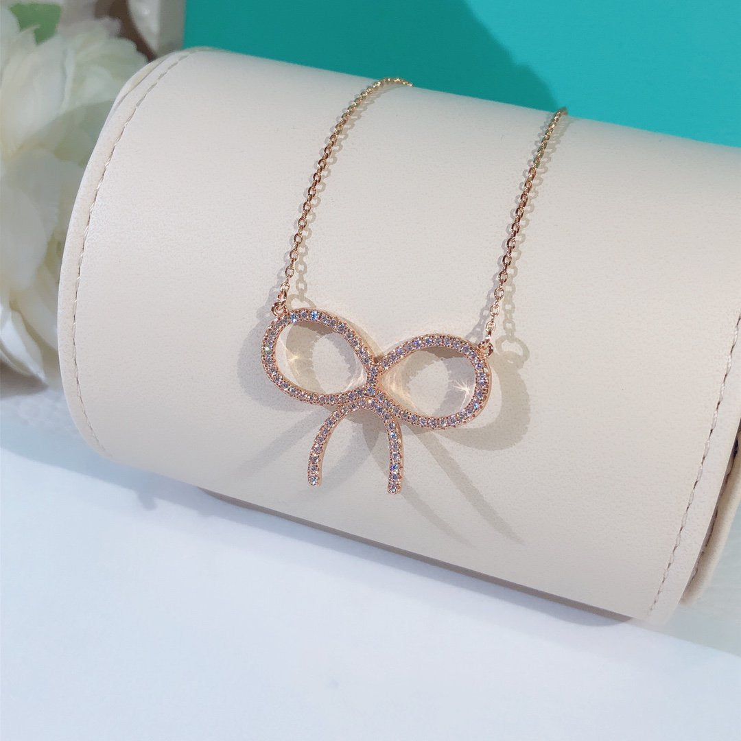 [Hyrra Jewelry]CLAW SET RHODIUM PLATED BOW NECKLACE