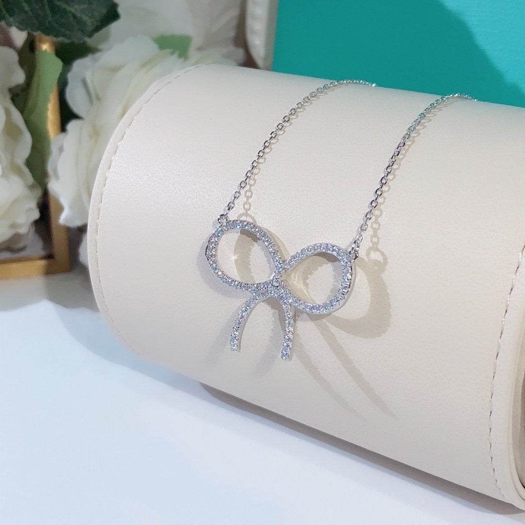 [Hyrra Jewelry]CLAW SET RHODIUM PLATED BOW NECKLACE
