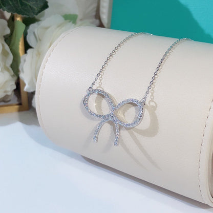 [Hyrra Jewelry]CLAW SET RHODIUM PLATED BOW NECKLACE